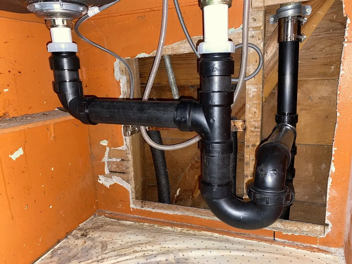 Professional Garbage Disposal Repair equipment and tools on the job in Clinton